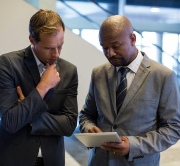 business-people-using-digital-tablet_107420-95867b business-people-using-digital-tablet_107420-95867b